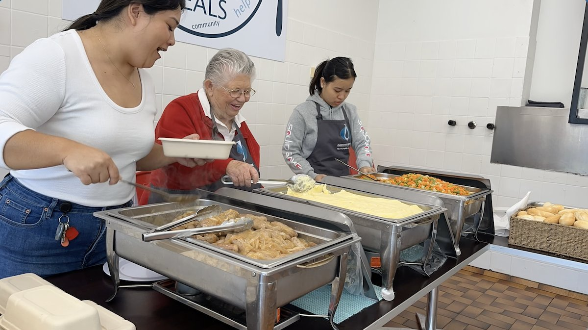 Oakdene Kitchen staff serving meals